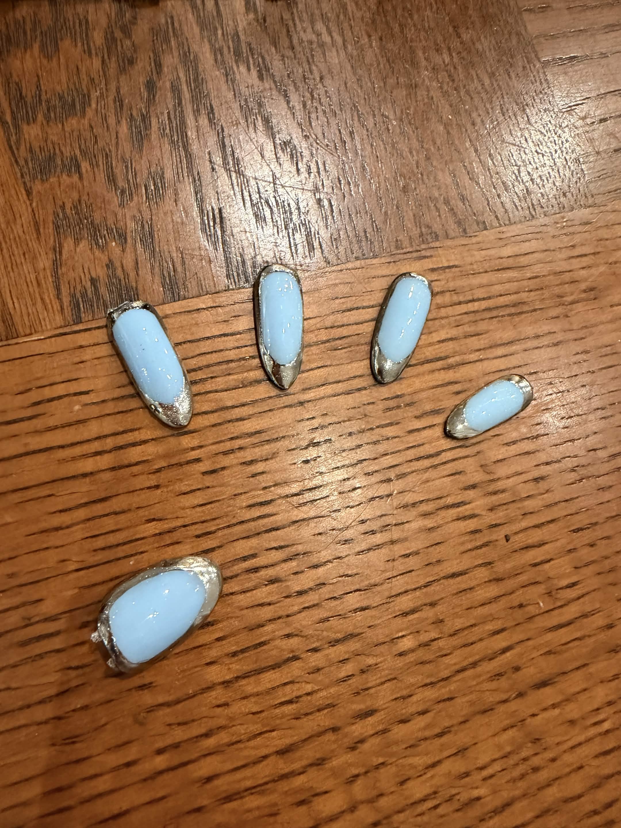 Baby blue press-on nails with silver chrome edging