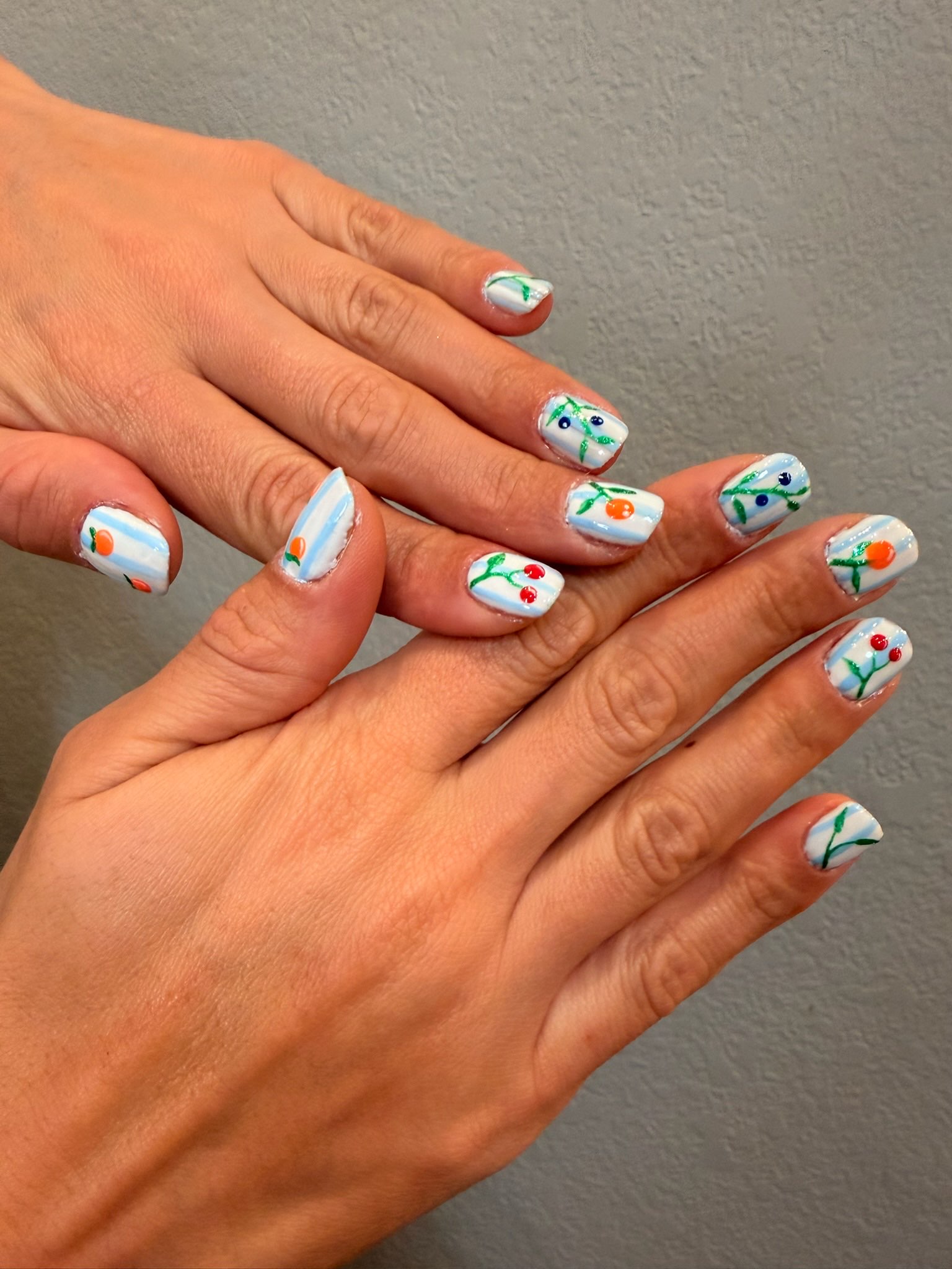 Light blue striped base with small fruit designs